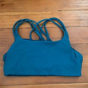 Athleta women’s sports bra in teal color.